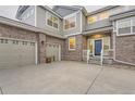 Stunning home with a three-car garage, brick and siding exterior, and a well-maintained driveway at 6401 S Millbrook Way, Aurora, CO 80016