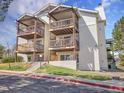 Exterior elevation showcasing a condo building with multiple units and outdoor wooden balconies at 17505 E Mansfield Ave # 1412R, Aurora, CO 80013