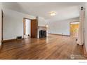 Spacious living room featuring beautiful hardwood floors and a cozy fireplace at 911 Lincoln Pl, Boulder, CO 80302