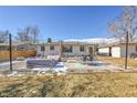Spacious backyard patio with seating and covered area at 1600 S Dahlia St, Denver, CO 80222