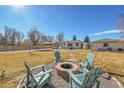 Relaxing backyard with fire pit and seating area at 1600 S Dahlia St, Denver, CO 80222