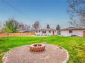 Spacious backyard features a fire pit area, perfect for outdoor entertaining at 1600 S Dahlia St, Denver, CO 80222