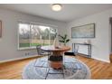 Cozy dining area featuring a round table, rug, and views of the backyard at 1600 S Dahlia St, Denver, CO 80222