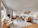 Bright living room with hardwood floors, stylish furniture, and ample natural light at 1600 S Dahlia St, Denver, CO 80222