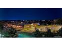 Aerial view of the community at night showing a park and other buildings at 5677 S Park Pl # 311A, Greenwood Village, CO 80111