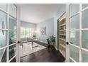 Bright home office with modern desk, built-in shelving, and French doors at 2204 Lasalle St, Superior, CO 80027