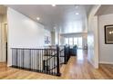 Open concept living space with hardwood floors, modern staircase and abundant natural light at 365 Casalon Pl, Superior, CO 80027