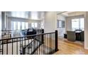 Open concept living space with hardwood floors, modern staircase and abundant natural light at 365 Casalon Pl, Superior, CO 80027