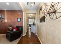 Inviting hallway with hardwood floors, decorative wall accents, and stylish decor, creating a warm and welcoming atmosphere at 8104 El Jebel Loop, Castle Rock, CO 80108