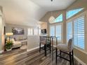 Small breakfast nook with two barstools and built-in shelving at 4760 S Wadsworth Blvd # H207, Littleton, CO 80123