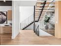 Bright entryway with a modern staircase, wood floors, and sleek design at 2475 S Saint Paul St, Denver, CO 80210