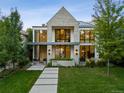 Beautiful home exterior with a manicured lawn and striking architectural details at 2475 S Saint Paul St, Denver, CO 80210