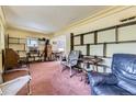 Cozy living room with vintage shelving and an open layout that offers flexible decorating options at 10040 W 13Th Pl, Lakewood, CO 80215