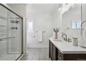 Modern bathroom with a glass shower and updated vanity at 5990 W 8Th Ave, Lakewood, CO 80214