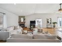Cozy living room featuring a fireplace and neutral decor at 5990 W 8Th Ave, Lakewood, CO 80214
