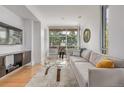 Inviting living room with hardwood floors, neutral decor, and large windows at 2758 W 22Nd Ave, Denver, CO 80211