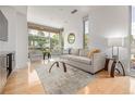 Bright living room with hardwood floors, large windows offering plenty of natural light at 2758 W 22Nd Ave, Denver, CO 80211