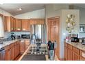 Modern kitchen featuring wood cabinets and an island cooktop at 10197 Crest View Dr, Morrison, CO 80465