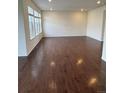 Bright and airy living room with hardwood floors and large windows, offering ample natural light at 10611 Casper St, Parker, CO 80134