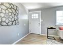 Bright entryway showcases stylish flooring, fresh paint, and a welcoming front door at 2921 E Colorado Ave, Denver, CO 80210