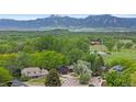 Breathtaking aerial view of a lush community with majestic mountains in the background at 4269 Carter Trl, Boulder, CO 80301