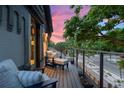 Cozy balcony with comfortable seating, perfect for enjoying the neighborhood views during sunset at 3410 Pecos St, Denver, CO 80211