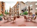 Charming courtyard featuring tables with umbrellas and a beautiful fountain at 4500 Baseline Rd # 3101, Boulder, CO 80303