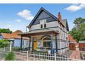 Beautiful exterior view showcasing the home's architecture, landscaped yard, and inviting front porch at 274 S Lincoln St, Denver, CO 80209