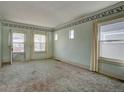 Bright living room filled with natural light, showcasing the room's charm and potential at 2963 S Lincoln St, Englewood, CO 80113