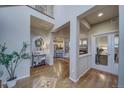 Spacious living room with hardwood floors, open layout and designer finishes at 21682 E Stroll Ave, Parker, CO 80138