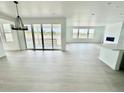 Bright living area with hardwood floors, fireplace, and sliding glass doors leading to the outdoor space at 16521 Black Rose Cir, Parker, CO 80134