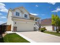 Charming two-story home with a two-car garage, beautiful landscaping and a spacious driveway at 245 Homestead Way, Brighton, CO 80601