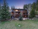 A spacious deck complements this home's inviting backyard and scenic view at 24 Pine Valley Rd, Evergreen, CO 80439