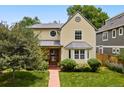 Inviting two-story home with well-maintained lawn and mature landscaping at 2432 S Columbine St, Denver, CO 80210