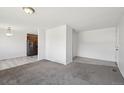 A cozy living room with carpet and light-colored walls at 16622 E Asbury Ave, Aurora, CO 80013