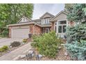 Beautiful two-story home with brick facade and inviting landscaping at 19098 E Ida Dr, Aurora, CO 80015