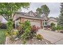 Attractive two-story house with a well-maintained front yard and inviting curb appeal at 19098 E Ida Dr, Aurora, CO 80015