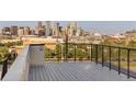 Spacious rooftop deck offering panoramic city views of downtown at 2060 Eliot St, Denver, CO 80211