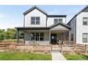 Two-story home with modern farmhouse exterior and landscaped yard at 3580 W 62Nd Pl, Denver, CO 80221