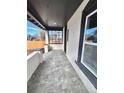 Spacious covered porch with durable tiled flooring and ample natural light at 3120 N Race St, Denver, CO 80205