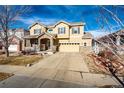 Inviting two-story home with a neutral color palette, attached garage, and nicely maintained front yard at 24191 E Iowa Pl, Aurora, CO 80018