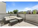 Outdoor balcony with comfortable seating area, perfect for relaxing and enjoying city views at 4774 Kittredge St, Denver, CO 80239
