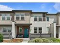 Charming townhome with a welcoming entrance and modern architectural details at 4774 Kittredge St, Denver, CO 80239