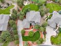 This aerial view showcases the home's spacious lot, backyard fire pit, and a long private driveway at 4586 Carefree Trl, Parker, CO 80134