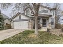 Charming two-story home featuring a two-car garage and stone accents at 10767 Appaloosa Ct, Parker, CO 80134