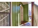 Exterior view of the entrance to an apartment unit with green siding and white trim at 2800 Kalmia Ave # B209, Boulder, CO 80301