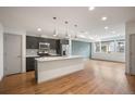 Modern kitchen featuring stainless steel appliances, an island, and sleek countertops at 5810 W 39Th Pl, Wheat Ridge, CO 80212