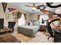 Bright bedroom with a bed, desk, and plenty of natural light at 5065 Eliot St, Denver, CO 80221