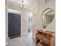 Inviting entryway featuring a dark door and decorative console table at 2640 Cache Creek Ct, Castle Rock, CO 80108