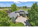 Expansive aerial view of a home with mature landscaping and a neighboring golf course at 4405 Fairway Ln, Broomfield, CO 80023